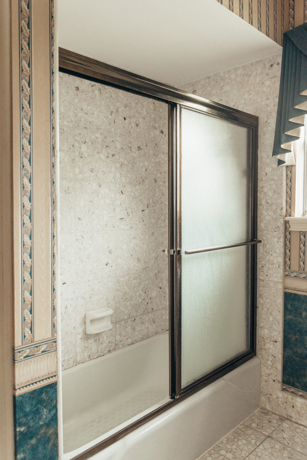 1970s bathroom before the renovation, showing its dated look